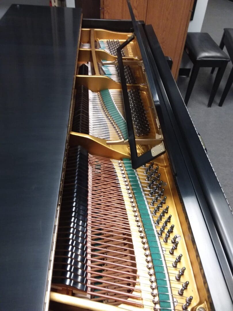 A piano with some strings attached to it
