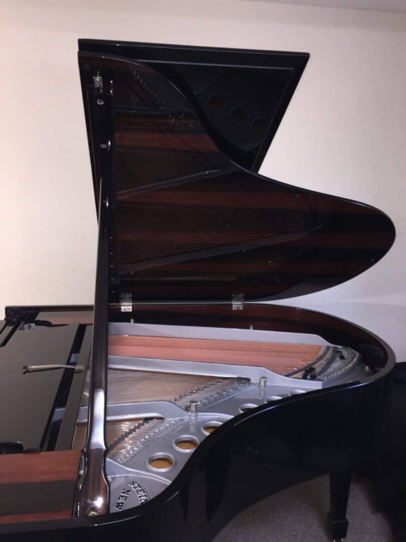 A piano that is sitting in the floor.