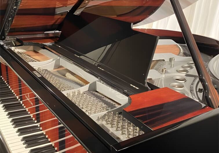 A piano that is sitting in the floor.